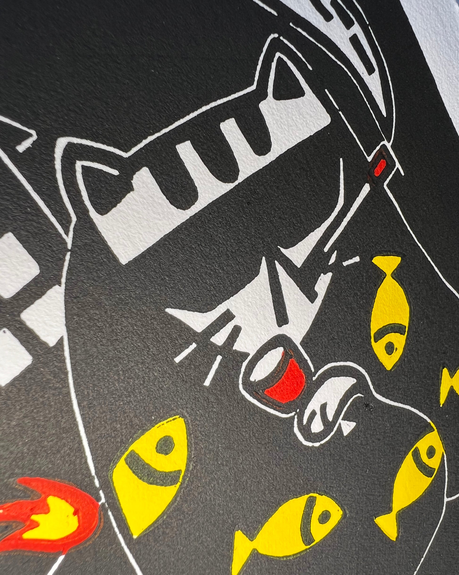 cat in a fish blanket drinking wine