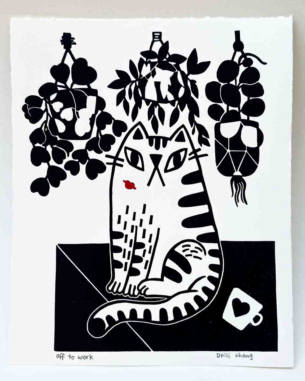 kiss on cat face, hanging plant