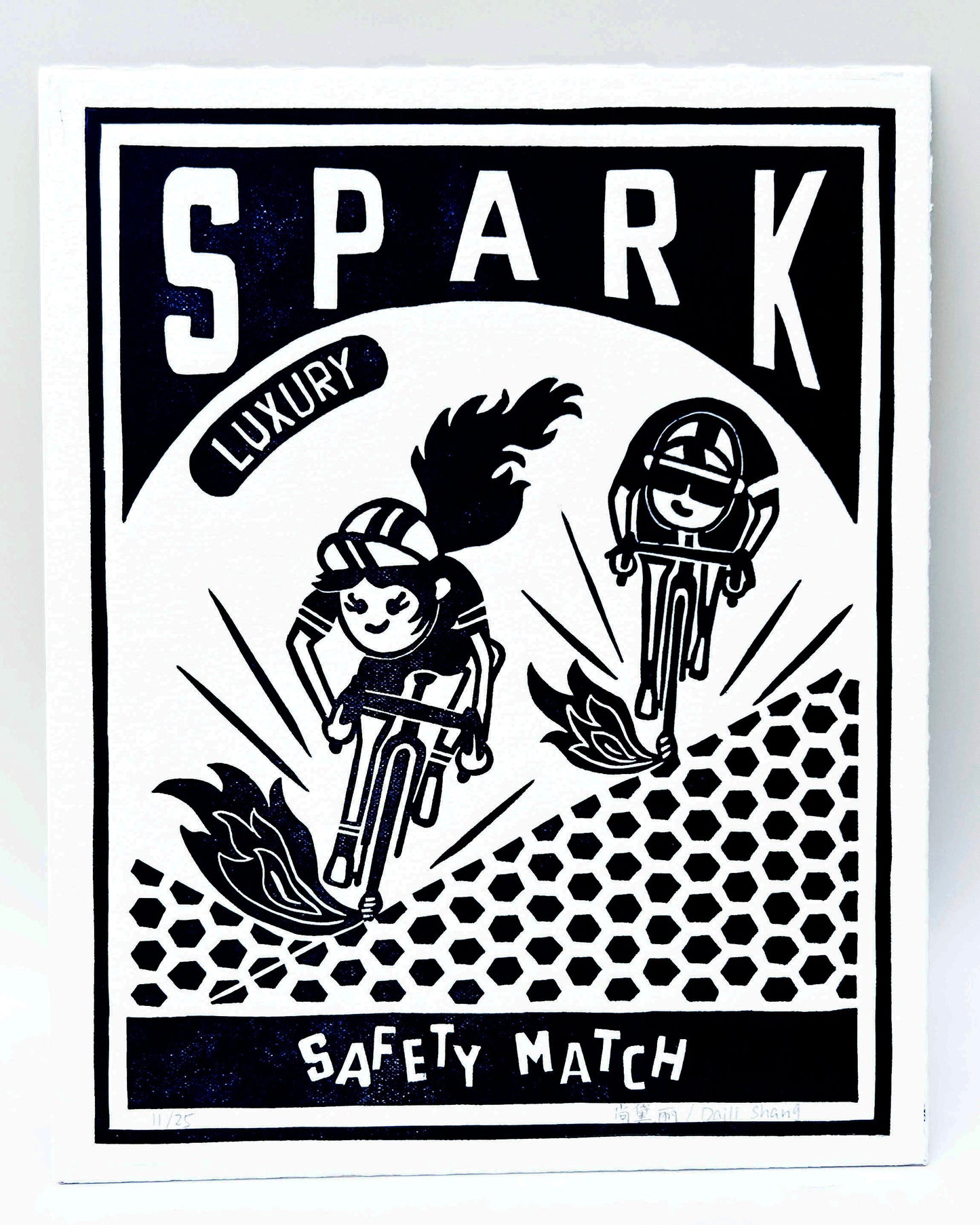 a girl and a boy riding bikes on a match box design